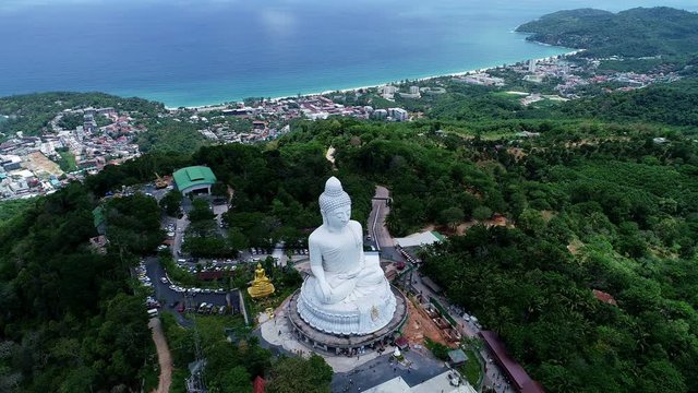 Aerial View drone shot of Big Buddha Statue on the high mountain at Phuket thailand
