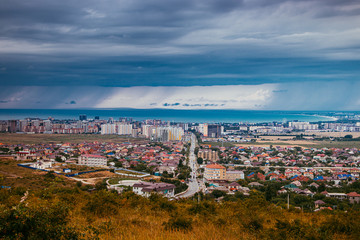 Obraz premium View of Anapa. View of the resort city. The vastness of Russia. Russian southern city. City from above. Many houses .. Buildings and architecture