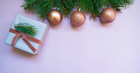 Christmas or new year frame composition. Christmas decorations in pink colors on pastel background with empty copy space for text. holiday and celebration concept for postcard or invitation. Top view.