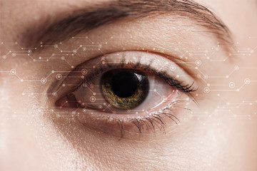 close up view of human eye with data illustration, robotic concept