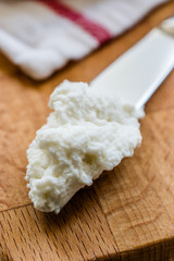 Ricotta Cheese with Knife on Wooden Board Ready to Eat.