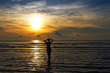 Woman with bikini silhuoette on beach