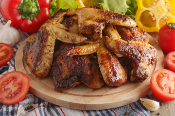 Chicken wings barbecue with different vegetables