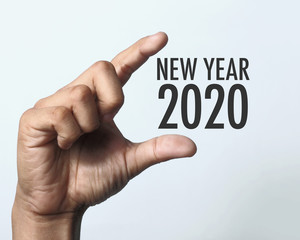 Year 2020 with hand.