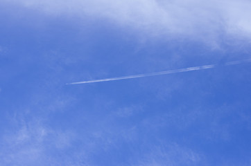 airplane contrail in blue sky