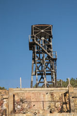 Fototapeta na wymiar Abandoned ore mining tower former iron mine