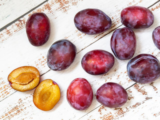 Plums on a light background. Summer vitamins