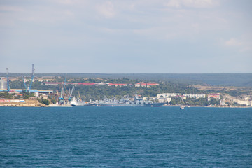Fototapeta na wymiar Sevastopol Bay in the summer in sunny weather. Crimea, Russia. A lot of boats and ships. Bay for boats.