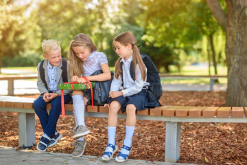 school friends in the park wish girlfriend happy birthday, holiday surprise, give gifts. emotions