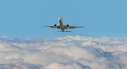 White passenger airplane in the clouds - Travel by air transport