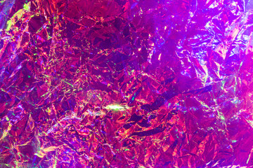 Holographic iridescent surface wrinkled foil pastel. Real Hologram Background of wrinkled abstract...
