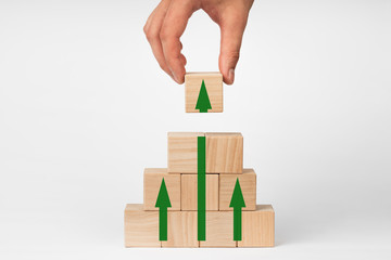 Wooden cubes with up arrow. Growth concept