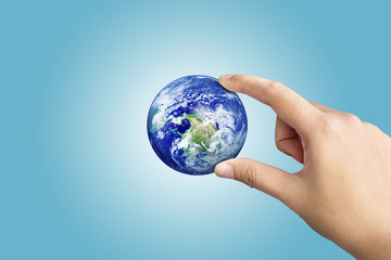 Hand Holding Earth On Blue Gradient Background, Save The World Concept,Elements of this image furnished by NASA