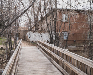 Bridge over Santa Fe River and houses in Santa Fe, NM, USA