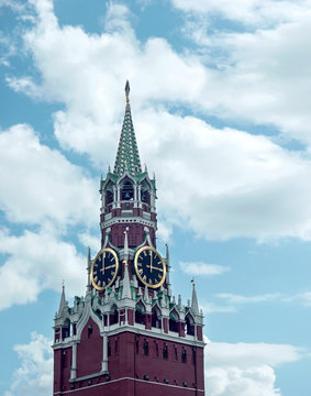 Spasskaya tower of the Moscow Kremlin with a clock-chime against the sky. Moscow, Russia.