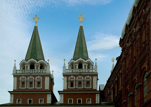 Towers of the Resurrection (Iversky) Gate on Red Square against the background of the summer sky. Moscow, Russia.