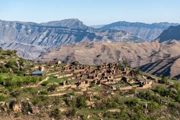 Abandoned mountain village with yellow houses