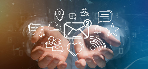 Businessman holding a cloud of social media network icon