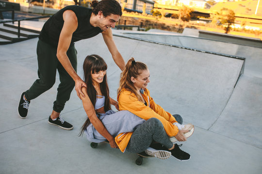Group of friends enjoying at skate park