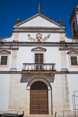 Old Portuguese street. Classic architecture and church from Portugal. Vintage cultural style.