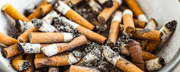 cigarette butts in ceramic bowl