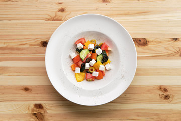 Salad with pepper, tomato, cucumber, olives and feta