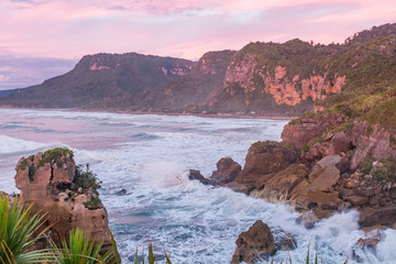 A view of the rugged coastline at sunset on the West Coast of New Zeland