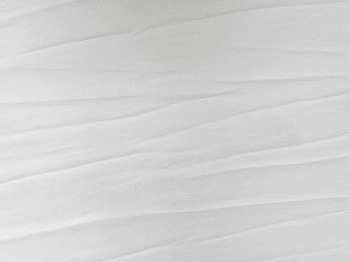 Soft white wrinkled fabric background