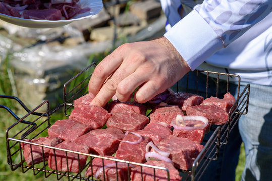  Summer Picinic. Raw Fresh Beef Meat Slices On A Grill With Onion Are Redy To Prepare.