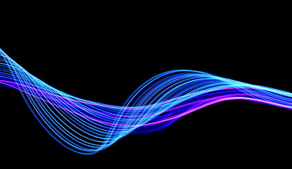 Long exposure, light painting photography.  Vibrant streaks of neon blue and pink color against a black background. - obrazy, fototapety, plakaty