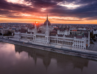 Fototapeta na wymiar Budapest, Hungary - Aerial panoramic view of the Parliament of Hungary at sunset/sunrise over River Danube and beautiful dramatic purple clouds