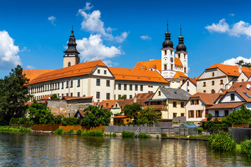 View of Telc across pond with reflections, Unesco world heritage site, South Moravia, Czech Republic.