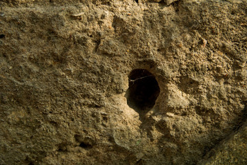 Sand texture with a black hole in the middle