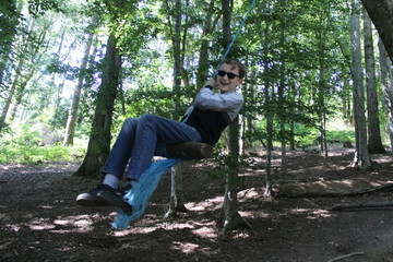 boy on ropeswing