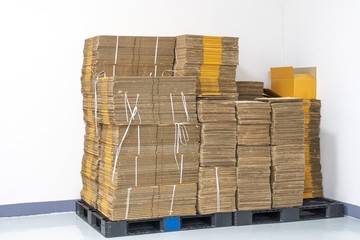 stack of flat pack cardboard boxes for product packaging and delivery.