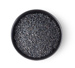 black sesame in a bowl isolated on white background. top view
