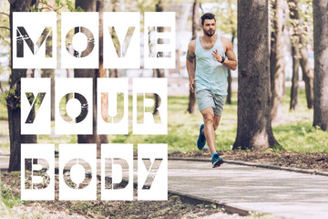 handsome man in sportswear running along walkway in sunny park with move your body lettering