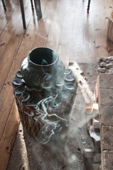  Runic pot on a wooden log