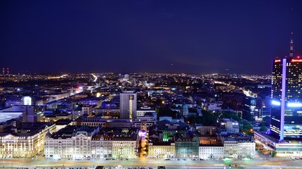 Fototapeta premium Modern office building at night. Night lights, city office building downtown, cityscape view