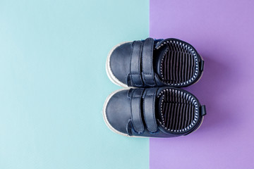 Children's blue shoes for the baby. Place for text. View from above