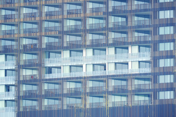 Fototapeta na wymiar exterior of building with many balcony terrace windows
