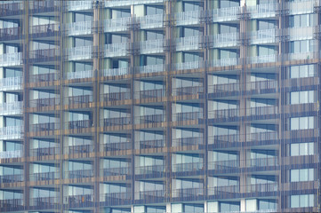 Obraz premium exterior of building with many balcony terrace windows