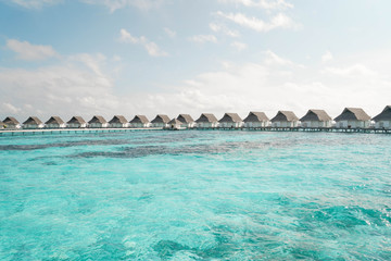 Beautiful Landscape of Over ocean Tropical beach summer resort hotel and spa, Maldives island with sea and sky tranquil for holiday vacation