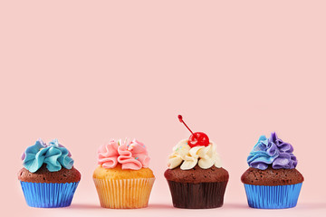Cupcakes variety on a pink background. Sweet food. Copy space