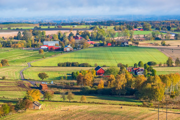 Fototapeta na wymiar Aerial view at a the countryside with farms and fields in autumn