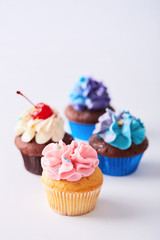 Cupcakes variety on a neutral background. Sweet food. Copy space