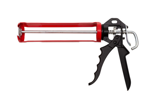 Caulking gun on white background