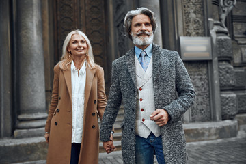 Couple walking hand in hand stock photo
