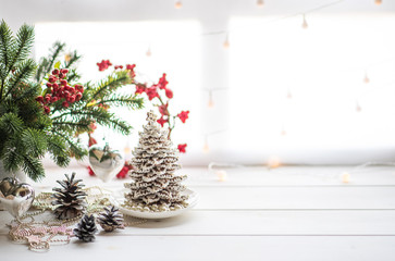 Christmas or new year still life with ornaments on rustic white table. Christmas cookies with festive decoration. Homemade gingerbread. Winter decoration background. Copy space for text.