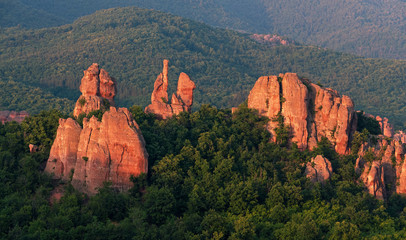 Fototapeta na wymiar Magnificent rocks among the forest at sunset. Belogradchik, Bulgaria.